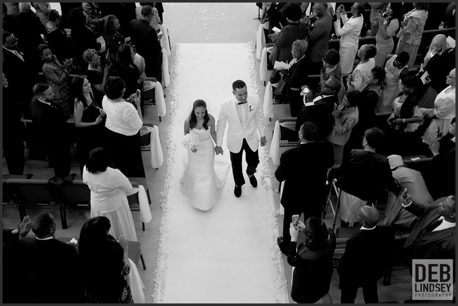 Bride and Groom walking down the aisle. Howerton+Wooten Events.