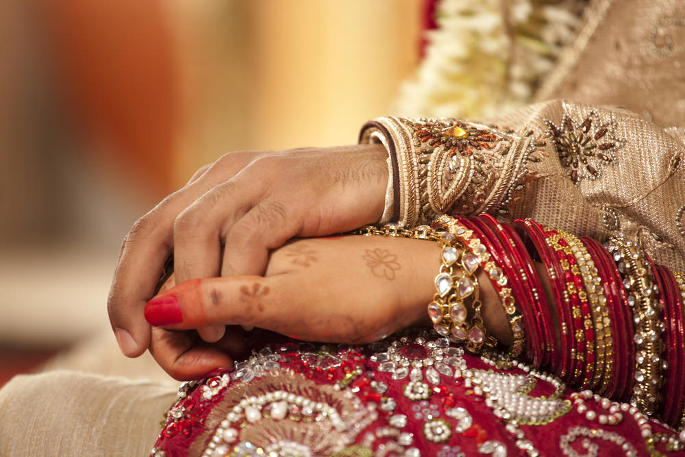 Indian Bride and Groom Holding Hands. Howerton+Wooten Events.
